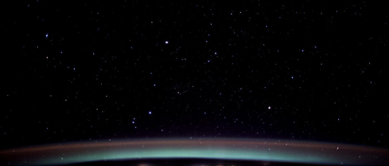 The lit edge of the Earth's atmosphere seen at night from orbit