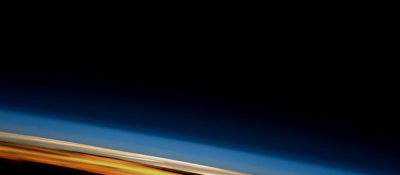 Sunrise along the edge of the Earth's atmosphere seen from orbit